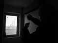 Roman prepares his methadone inside an unused building in Kiev, Ukraine. The 17th floor is a secret spot where drug users can shoot up.