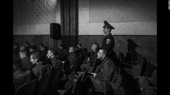 Juvenile inmates listen to priests sing at a penitentiary in Pryluky, Ukraine. Prison populations are another at-risk group for HIV, according to Vossen and Adler. There was an enormous amount of misconception about HIV, they said, with some of the prisoners believing it was spread by mosquitoes, kissing and hand-holding.