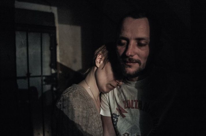 Sveta Moroz is reunited with her husband, Aleksei, in Kiev in 2014 after he spent months as a prisoner of war of a separatist group in eastern Ukraine. He hid his HIV status from his captors while Sveta managed to sneak his meds to him. Ukraine, 2014.