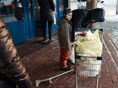 Alla, with her son, after receiving groceries paid for by Svitanok in 2016. HIV-positive, she fled her home just outside of Donetsk amid fighting and is now living with her son in Kramatorsk. Ukraine, 2016.