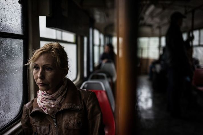 Olga on her way to a shelter for war-displaced people in Odessa. Ukraine, 2016.